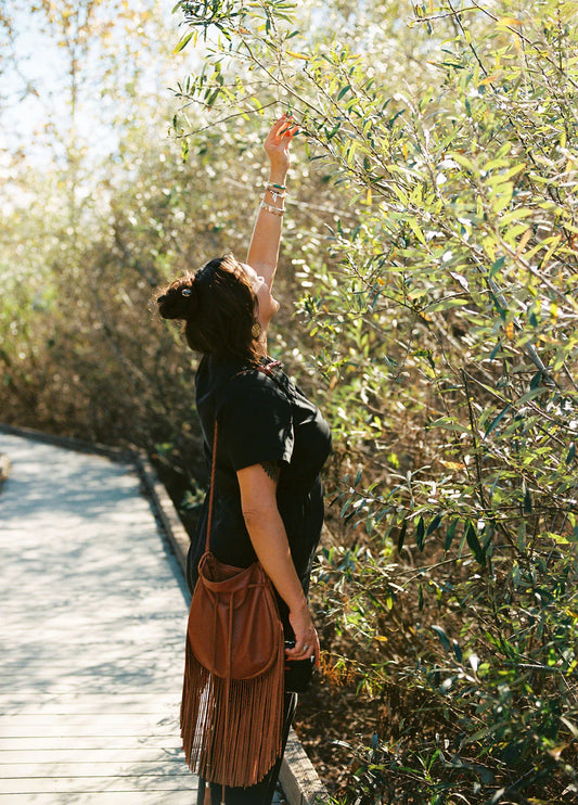 Shop Native Gift Guide by Thread Spun featuring photography by Munoa Dyer - shown here with her Sweetgrass leather bag also featured in this Buy Native guide