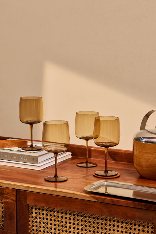 A modern wine glass rendered in thin, colored mouth blown glass with a clean, balanced form. Suited for both red and white wines, adding depth and character to casual or formal settings.