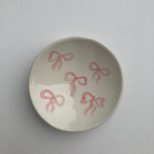 This little ceramic ring dish is made with white stoneware clay that fires warm white / beige color. Each little plate is hand painted with underglaze, all designs are free style painted and never exactly the same. Finally its glazed with clear glaze and signed underneath.
Freely hand painted.Handmade by Alicja in her Vermont studio.