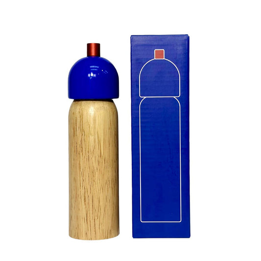 Wooden pepper grinder with blue top and matching packaging on a white background