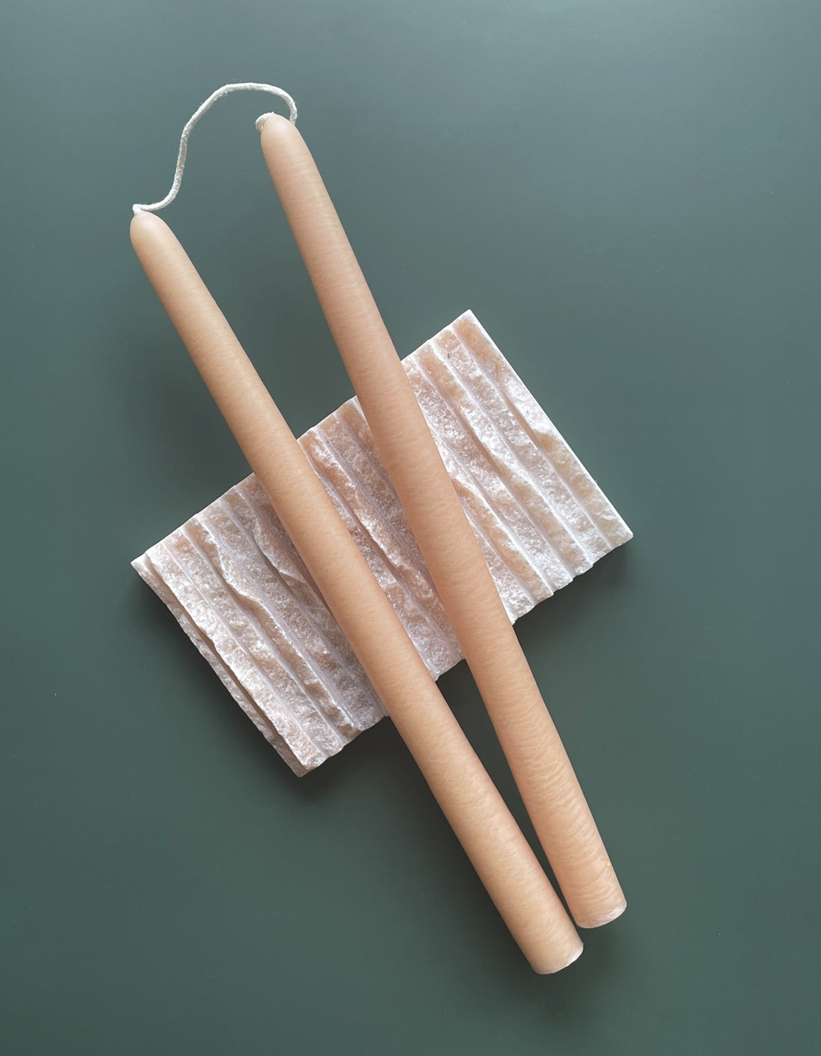 Botanica's pair of tapered candles are dipped over 20 times by hand, creating the ideal taper–dripless and smokeless–perfect for dinner parties and creating warm, homey ambiance.