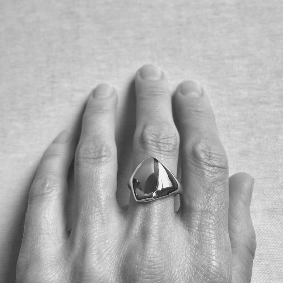 The melted signet artisan ring by Species by the Thousands. Hand cast brass in wax.