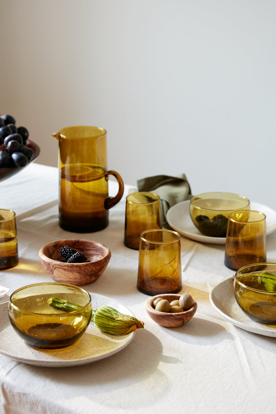 Handcrafted in Tunisia using natural olive wood from the region, these little bowls are hard, durable and non porous. Each piece is unique and becomes even darker, richer and more beautiful in color as it ages.