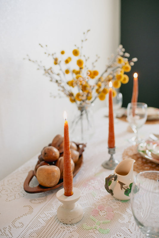 happy organics Beeswax tapers that have been meticulously shaped to resemble fresh carrots, these candles are a delightful fusion of artistry and nature. Made from pure beeswax, they emanate a natural, sweet aroma