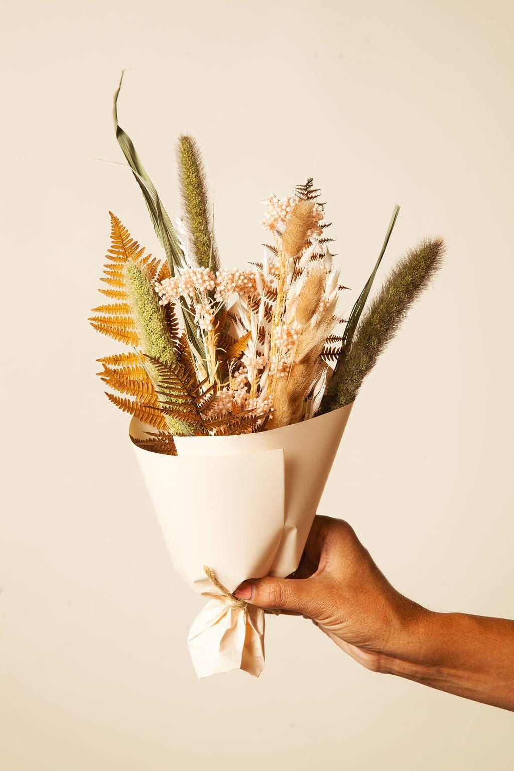 This dried bouquet is carefully arranged by a team of designers in Idlewild Floral Co's California studio, and are made of beautifully preserved long lasting flowers. Perfect paired with a bud vase or as a gift for any occasion. Each bouquet is 12"-14" long x 4"-6" wide.