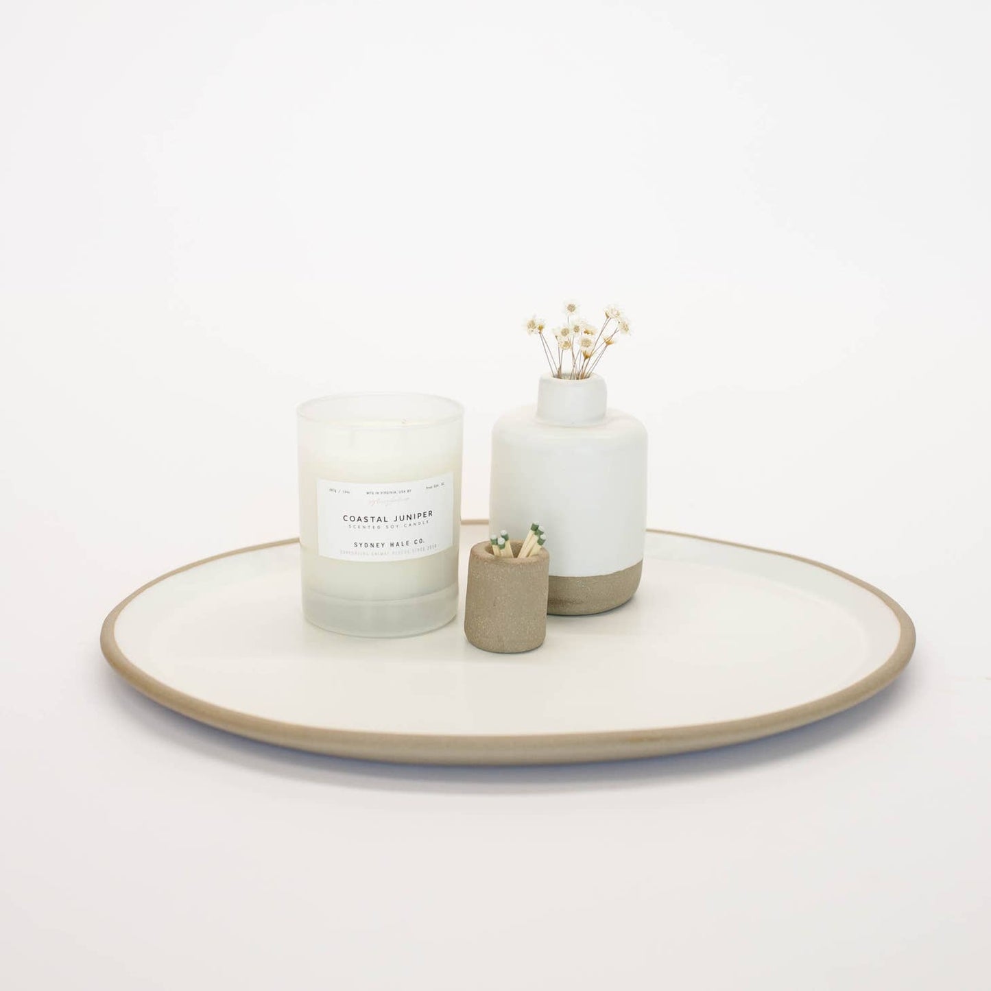 Hand-built with shallow walls, some organic quality around the rim, and a flat base, this ceramic platter is designed for serving. Use it as a charcuterie board, snack platter, coffee table tray, or your main course! Handmade in Virginia