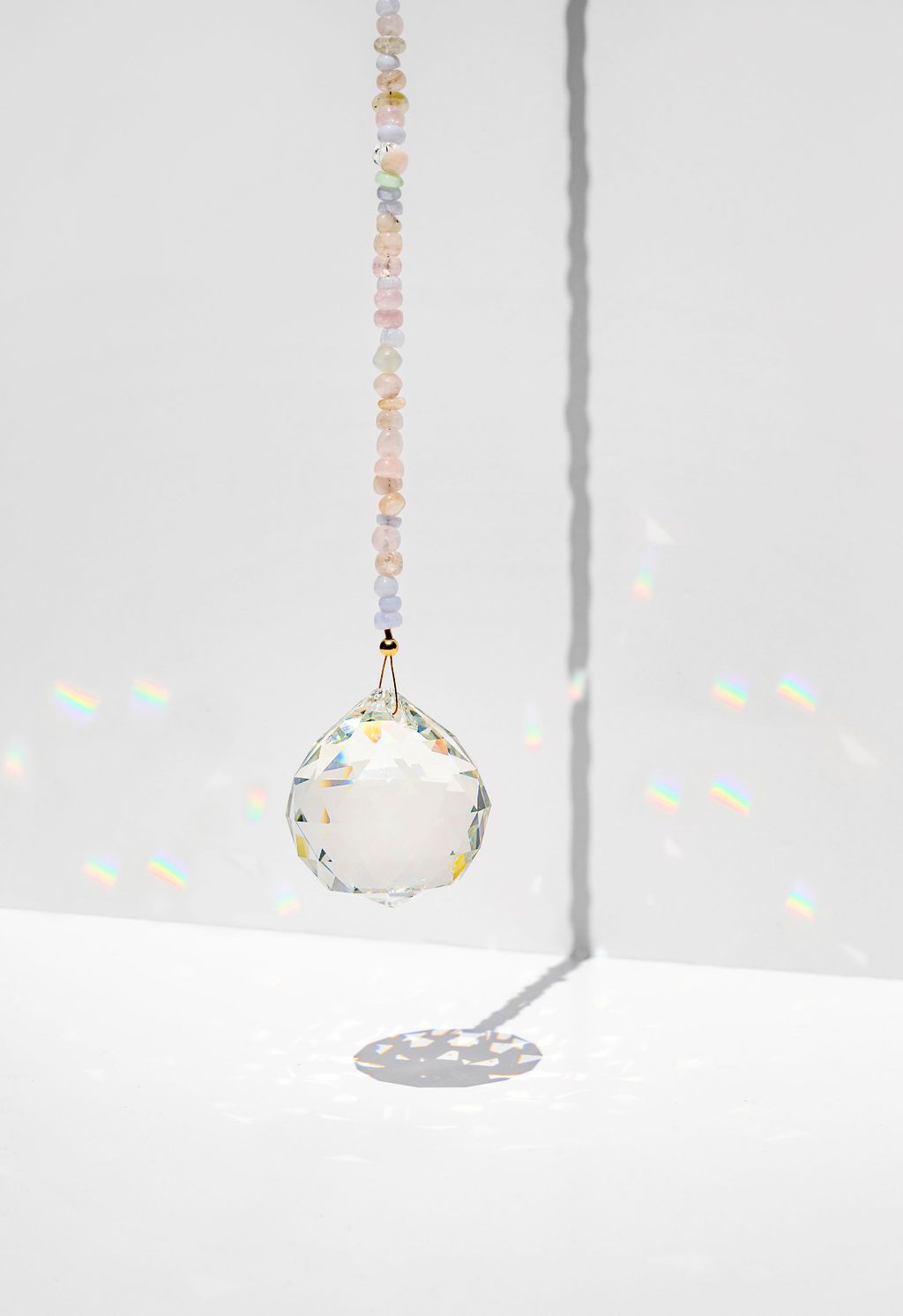 punkwasp by carrie marill window prism - Energize your space with a window prism - hang in a sunny spot & watch the rainbows dance! Hanging Feng Shui window prisms within the home can balance the energy and activate a stale space :: freshwater pearls for an extra dose of harmony.