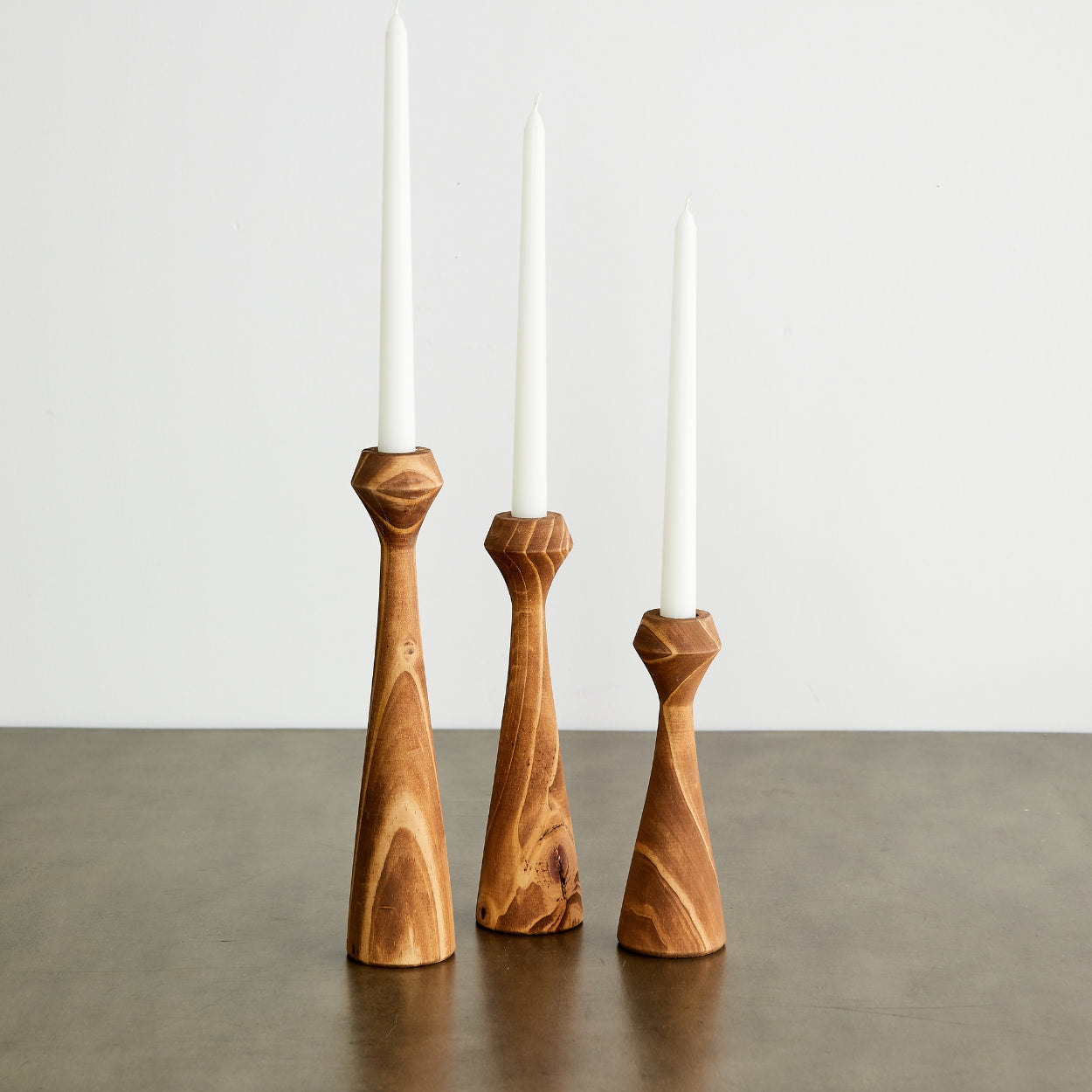 These hand-turned candle holders are expertly crafted by South African artisans that have been in family woodworking businesses for generations. Made from sustainably sourced pine, they are both trend-forward and timeless.