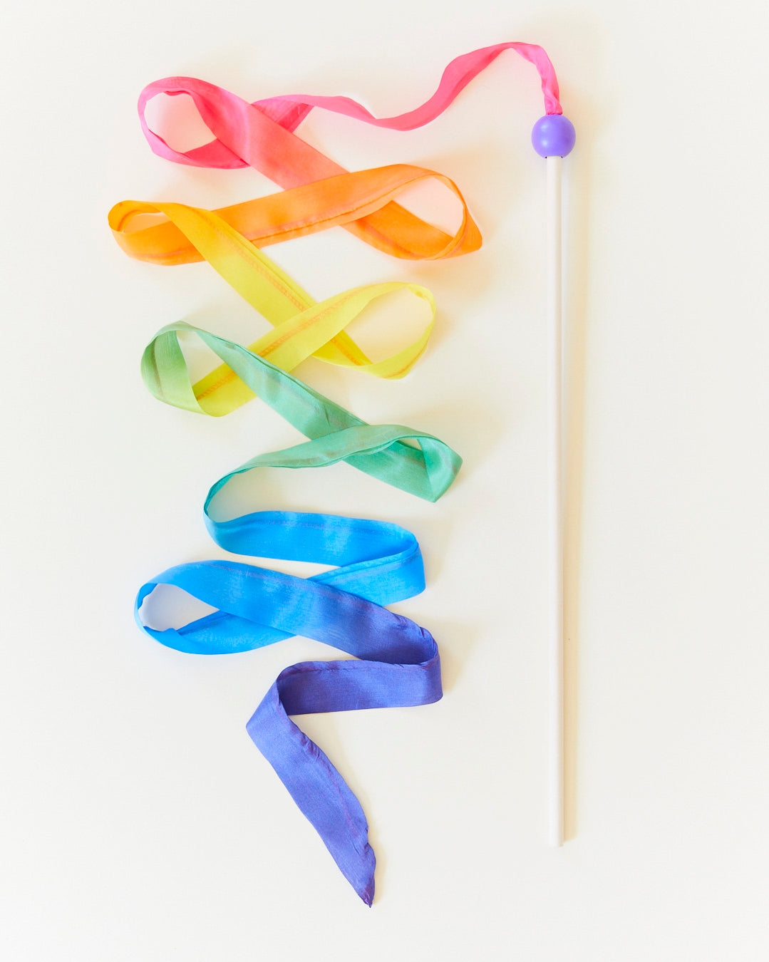 Streamers encourage children to play actively, increase their quality of movement, and make them want to dance! Some pretend play ideas include waving in the wind, writing letters in the air, pretend fishing, dancing, and more. A wooden sticker with a strip of rainbow made from gorgeous, lightweight 100% pure silk.