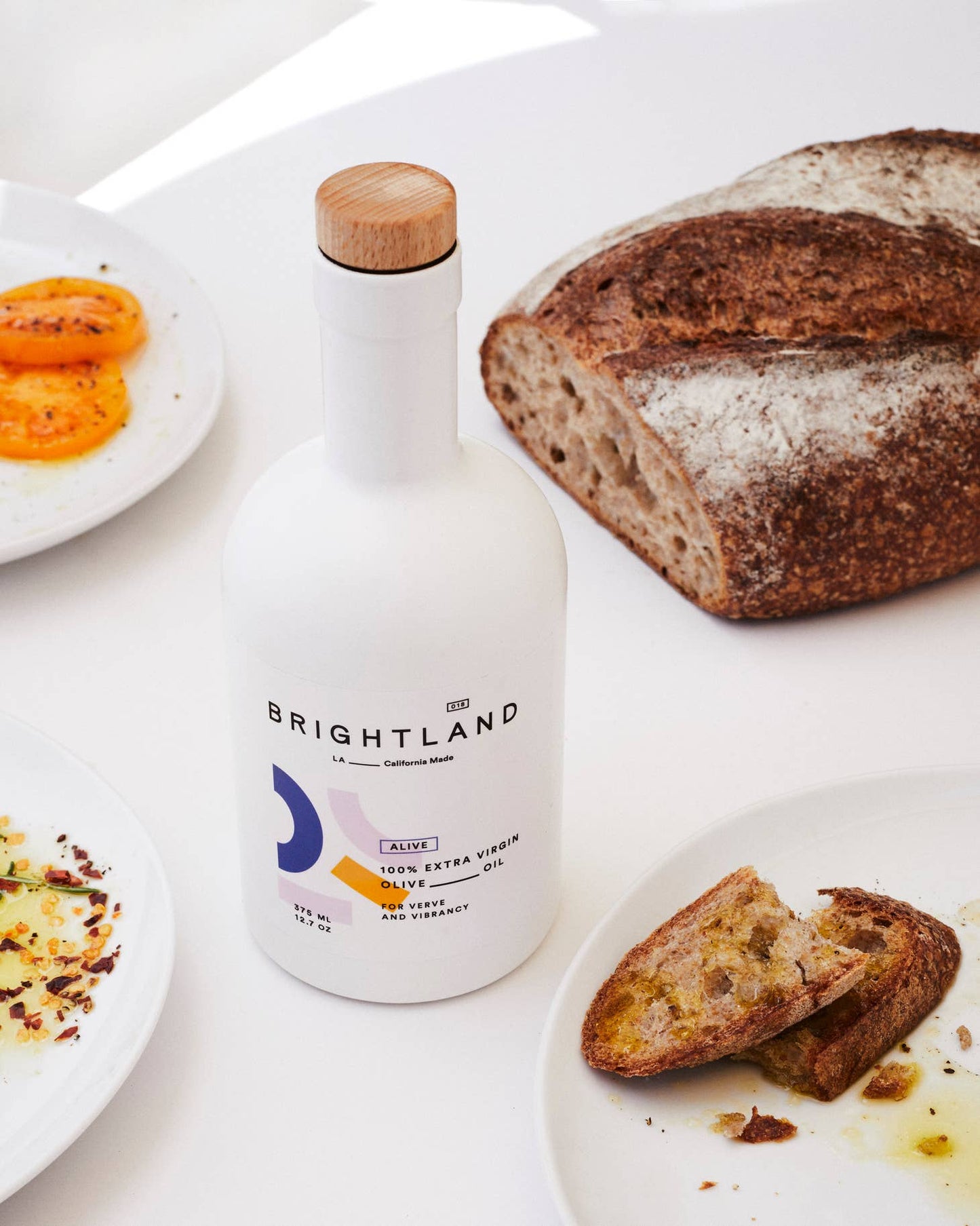 Alive is Brightland's smooth and grassy cold-pressed extra virgin olive oil ideal for salads, hummus, baked goods, fresh greens, and bread. Made with early-harvest arbequina, arbosana, and koroneiki olives grown on small family farms in California’s central valley.