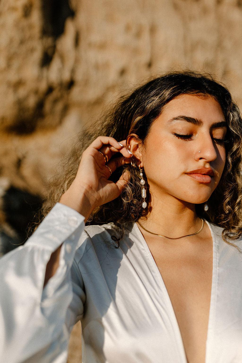 Unique and elegant, these pearl duster earrings were designed with 4 freshwater pearls in various shapes and sizes interconnected with delicate gold fill wire. All Dea Dia pieces are proudly designed and handmade in Downtown Los Angeles.