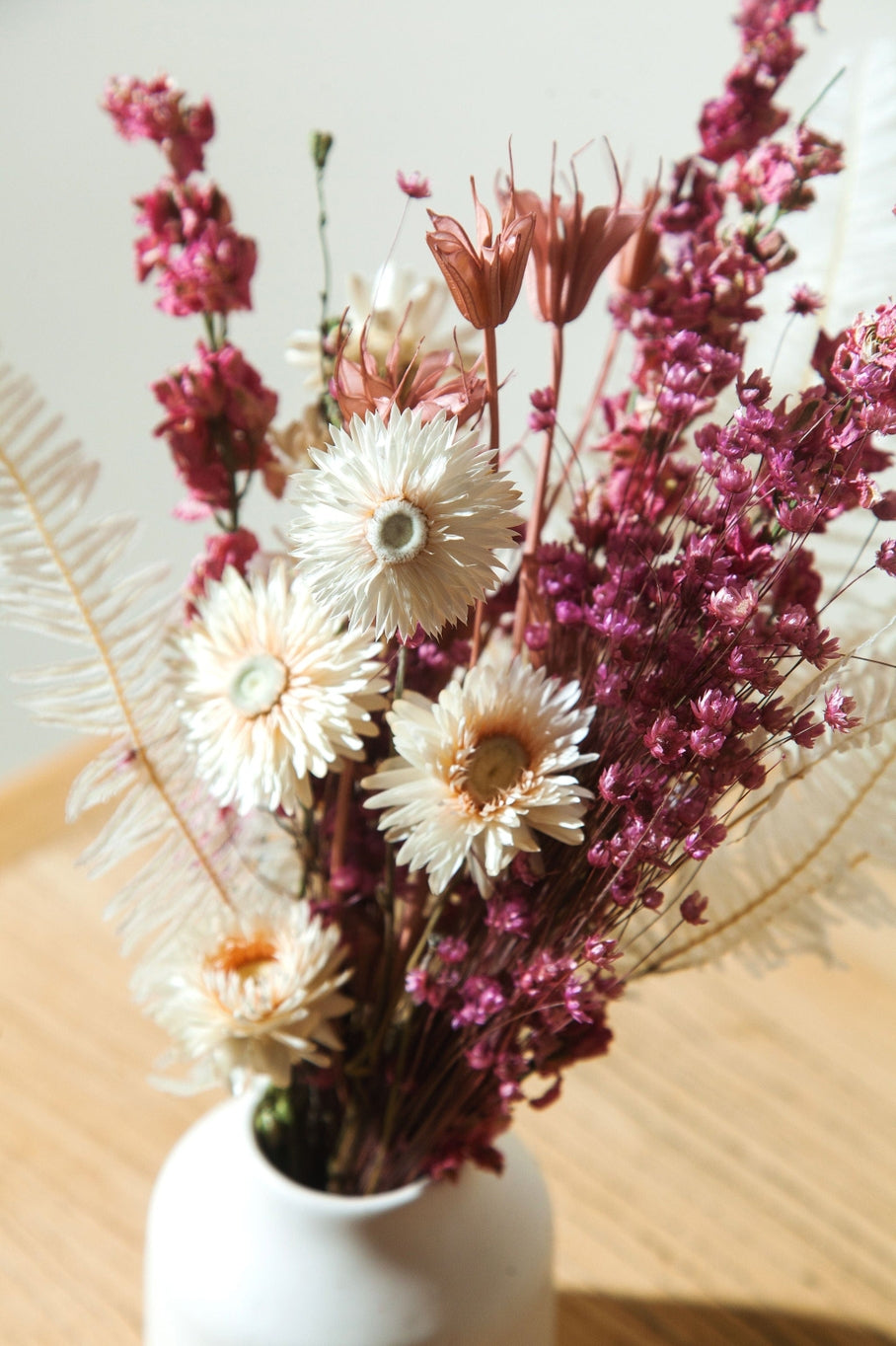 This dried bouquet is carefully arranged by a team of designers in Idlewild Floral Co's California studio, and are made of beautifully preserved long lasting flowers. Perfect paired with a bud vase or as a gift for any occasion. Each bouquet is 12"-14" long x 4"-6" wide.