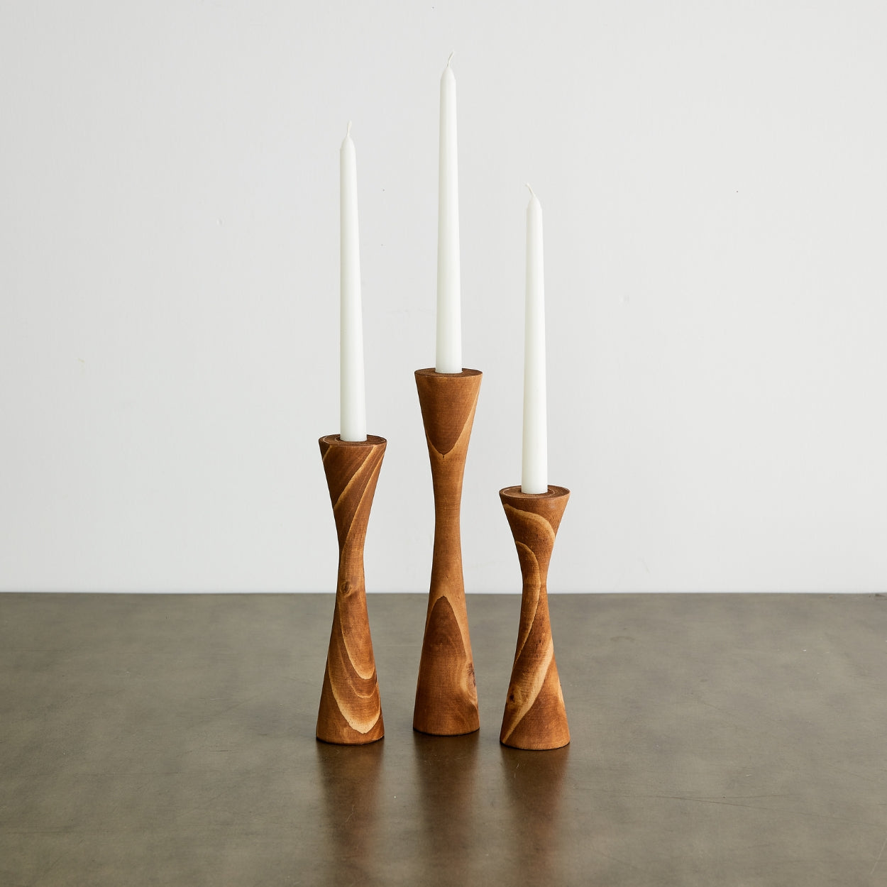 These hand-turned candle holders are expertly crafted by South African artisans that have been in family woodworking businesses for generations. Made from sustainably sourced pine, they are both trend-forward and timeless.