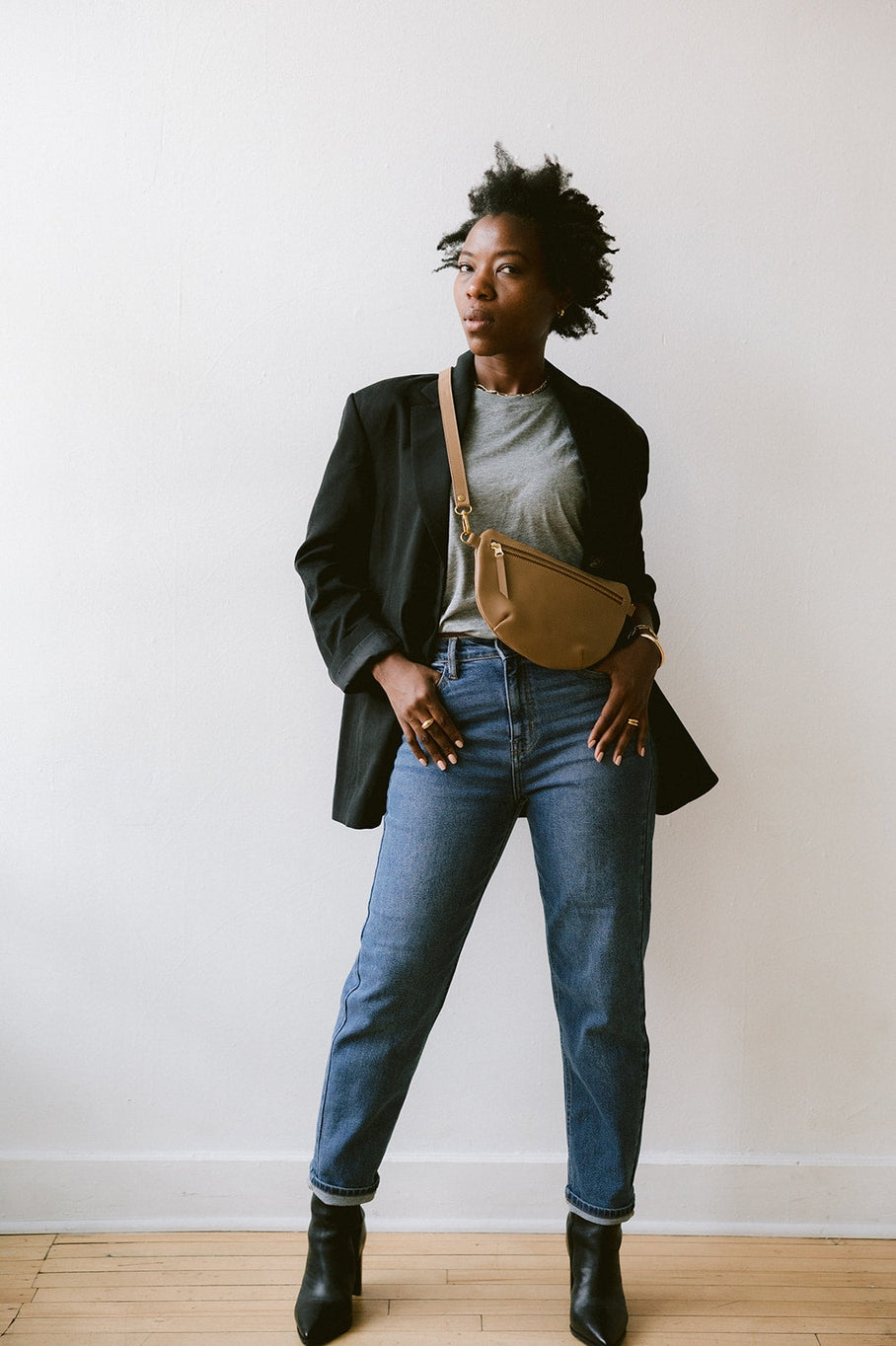 Fair trade and adjustable leather sling bag/fanny pack. Adjust the length to fit your needs. Handcrafted, vegetable tanned leather sling bag made in Kenya with locally and ethically-sourced materials. A portion of sales go to an organization in Tanzania empowering children living on the street.