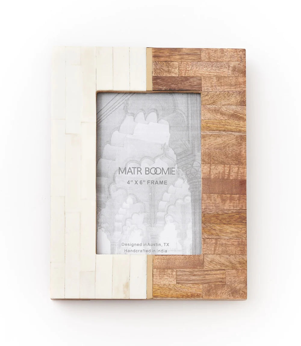 4 x 6. This handcrafted frame features cruelty free bone on one side and sustainably sourced mango wood on the other, with brass accents. For convenient display this frame features a table top easel and d-ring for hanging. All of Matr Boomie's collection is handmade, fair trade and sustainable.