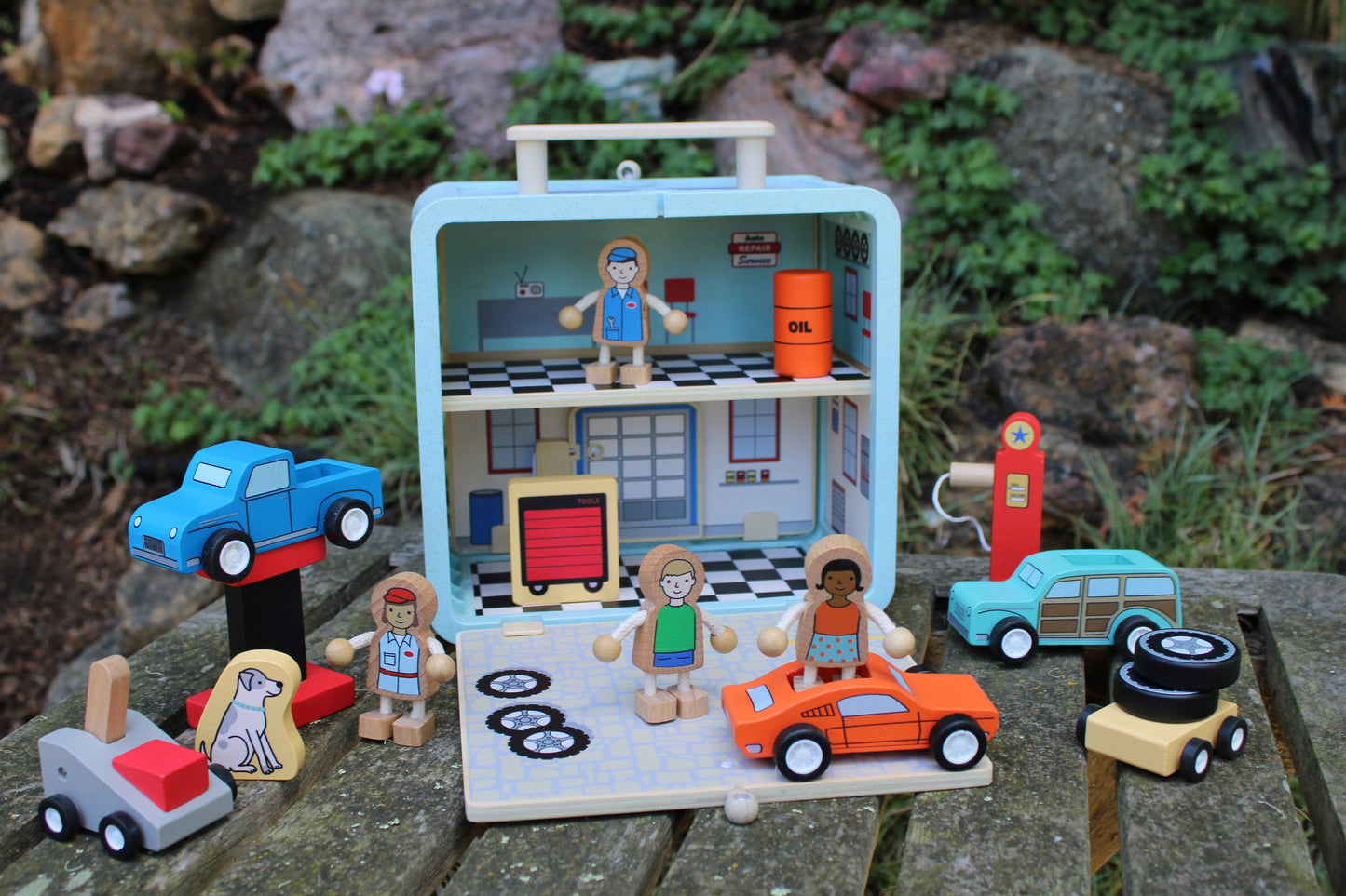 Suitcase Series encourages portable play. Each suitcase opens up on both sides to reveal a world of fun.
The 16-piece Auto Repair Shop has everything you need for hours of fun, including cars, lift, retro gas pump, customers, mechanics, and more!