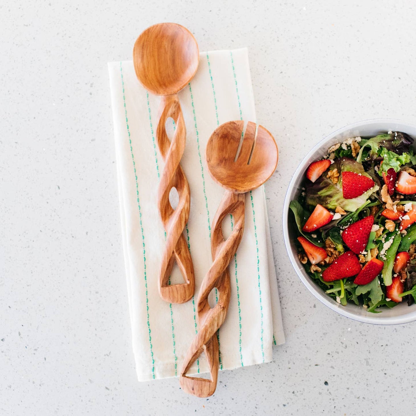 These twisted serving spoons are perfect for salads & are delicately carved from durable olive wood. Wild olivewood has a rich grain and is indigenous to East Africa. Ethically made in Kenya.