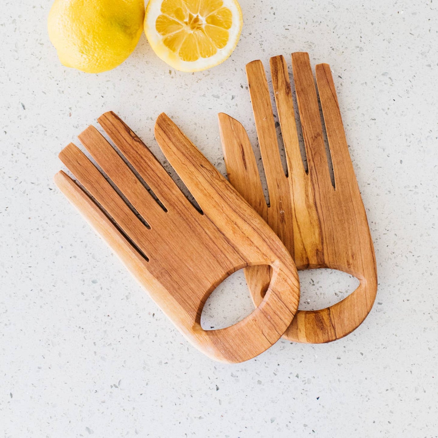 These serving hands are perfect for salads & shaped from durable olive wood. Wild olivewood has a rich grain and is indigenous to East Africa. Ethically made in Kenya.