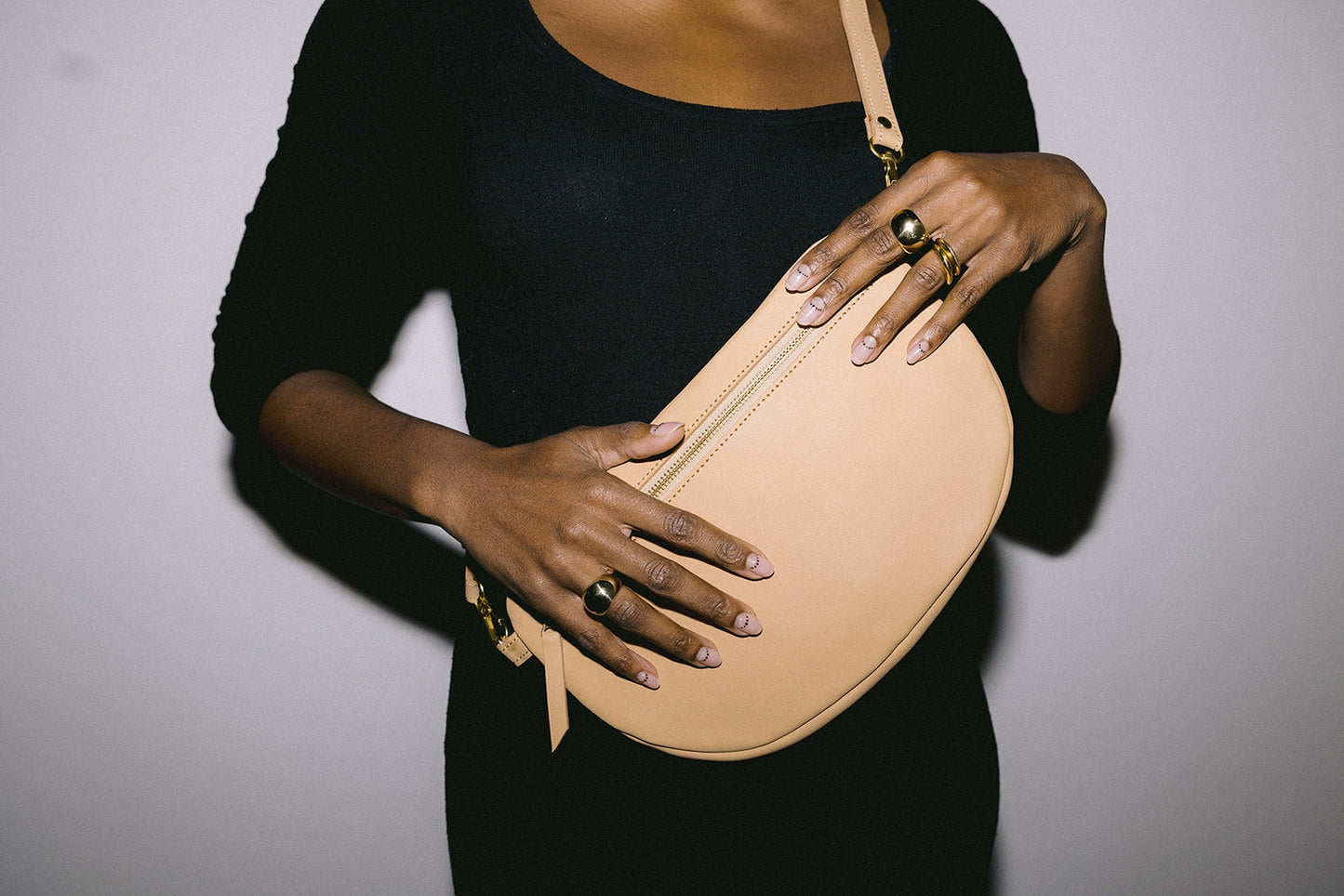 The best-selling Sling Bag is now available in a bigger size. Still sleek, lightweight, and chic, now you'll be able to add that *one* extra thing. Your large wallet, glasses case, or even a small book will fit inside the Big Sling. Fair trade and adjustable leather sling bag/fanny pack.