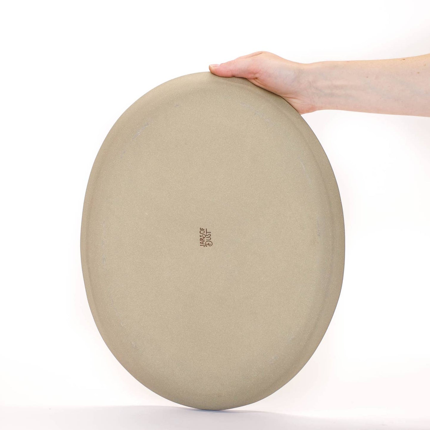 Hand-built with shallow walls, some organic quality around the rim, and a flat base, this ceramic platter is designed for serving. Use it as a charcuterie board, snack platter, coffee table tray, or your main course! Handmade in Virginia