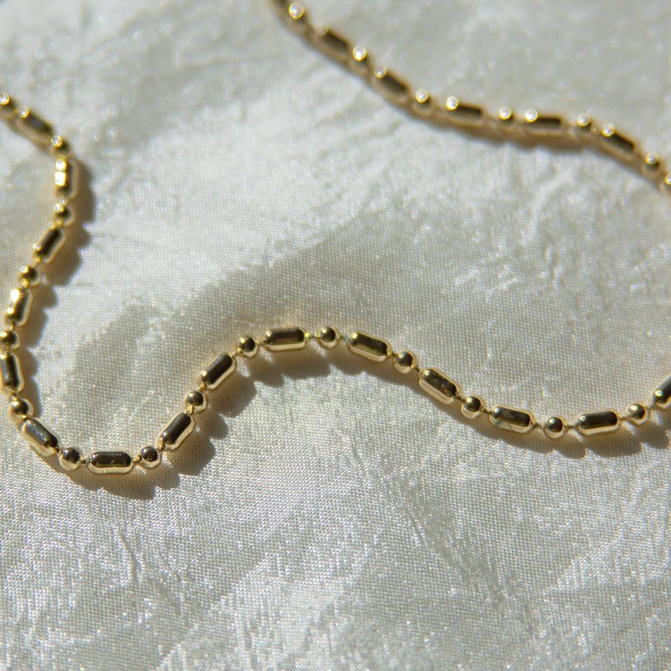 Unique, deadstock vintage ball chain necklace made current with a fresh plating of 14k gold. A perfect 90s vibe chain; use it to layer or add your favorite pendant. This 90's ball chain necklace comes with a long and short pattern. Designed and handmade in Los Angeles.