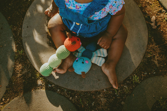 This hand crocheted rattle is designed to delight little hands and engage curious minds. The gentle rattle sound encourages sensory exploration while the soft, tactile textures make it perfect for grasping, shaking, and cuddling.