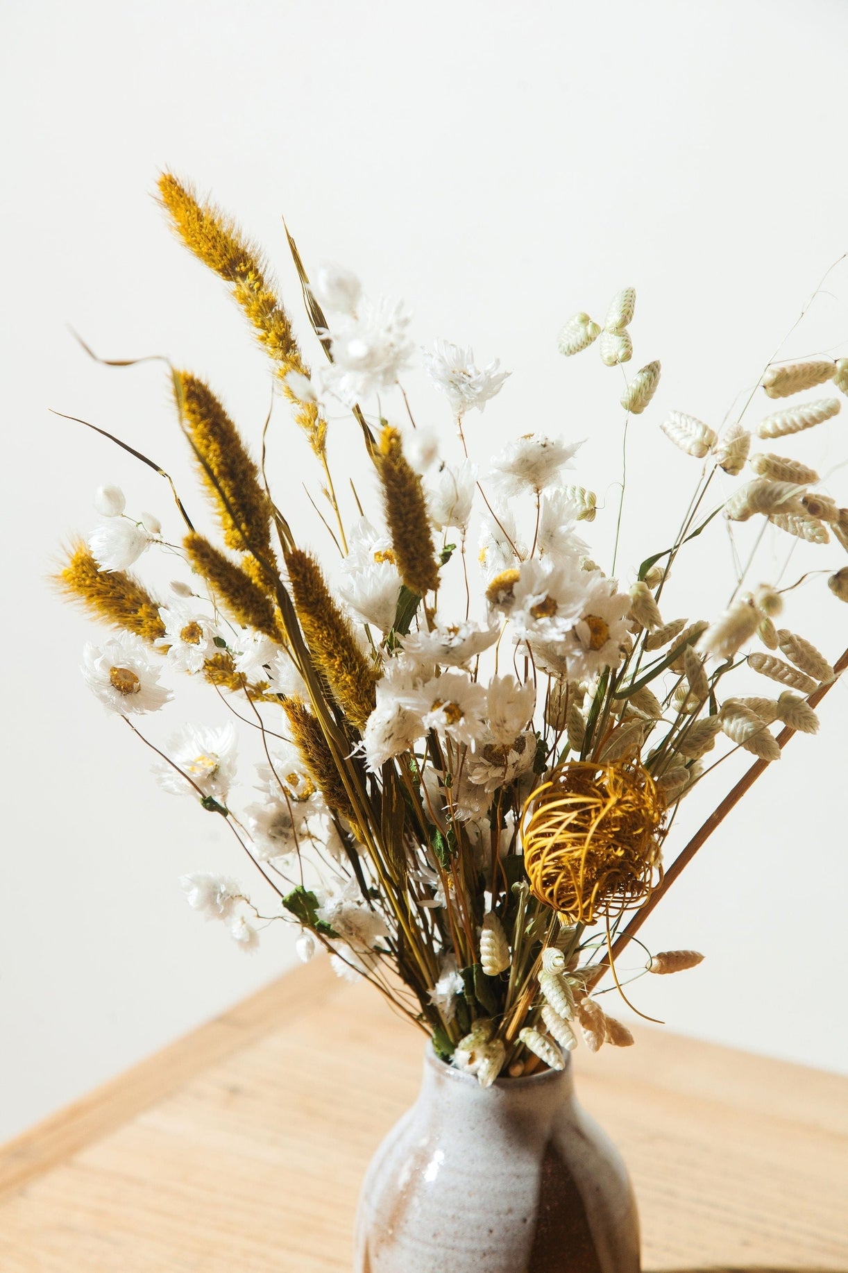 This dried bouquet is carefully arranged by a team of designers in Idlewild Floral Co's California studio, and are made of beautifully preserved long lasting flowers. Perfect paired with a bud vase or as a gift for any occasion. Each bouquet is 12"-14" long x 4"-6" wide.