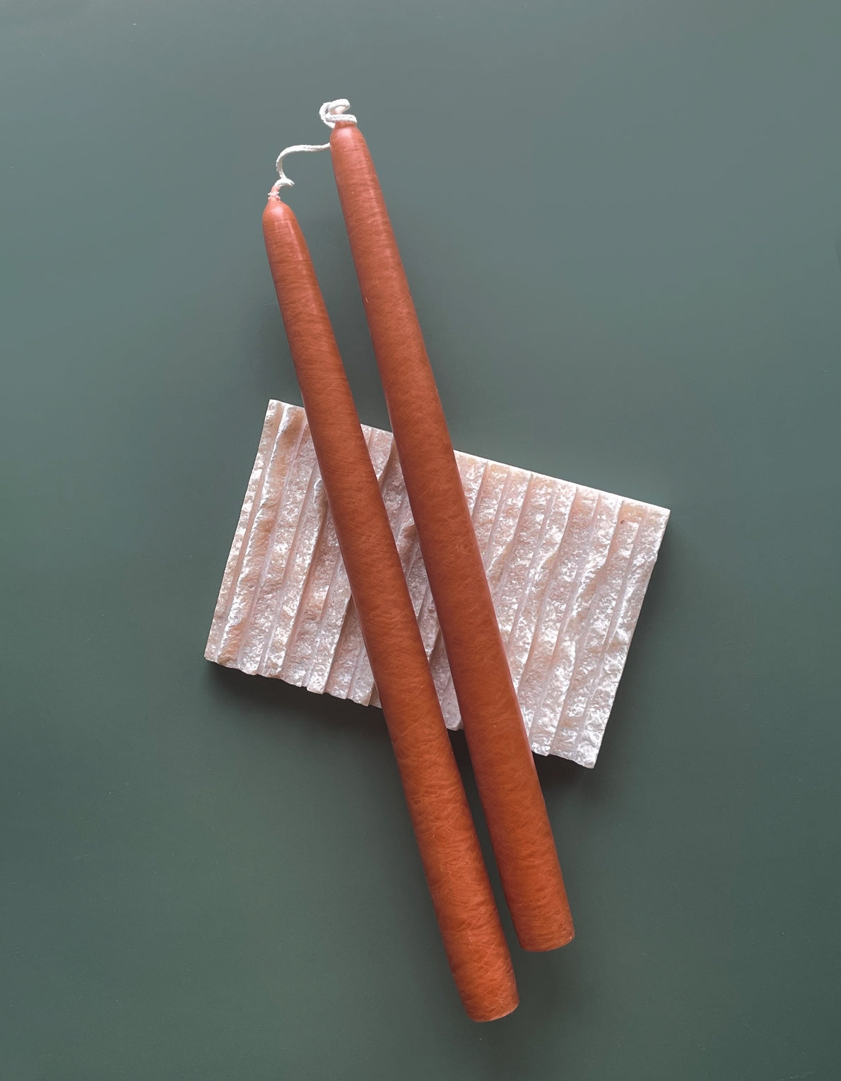 Botanica's pair of tapered candles are dipped over 20 times by hand, creating the ideal taper–dripless and smokeless–perfect for dinner parties and creating warm, homey ambiance.