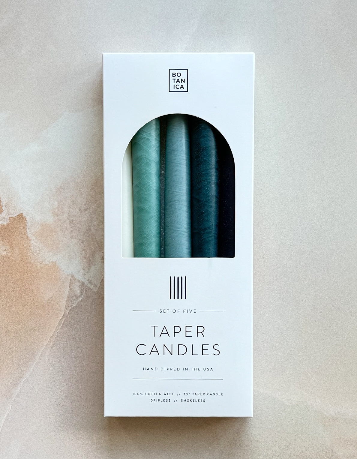 Botanica's set of five tapered candles are dipped over 20 times by hand, creating the ideal taper–dripless and smokeless–perfect for dinner parties and creating warm, homey ambiance.