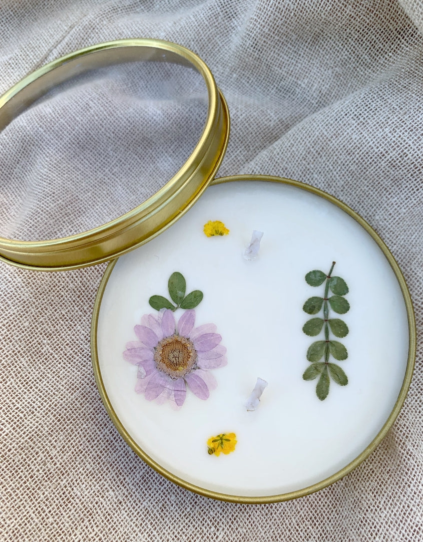 Hand-poured floral press candleNotes of santal and coconut, black violet and saffron. While many coconut fragrances are on the sweet side, Islands leans on woody notes of sandalwood, and cedar. Made in San Diego, CA.