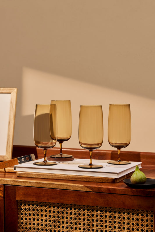 A tall, minimal silhouette in lightweight, solid-colored glass. Perfect for water, iced drinks, or long pours—designed for everyday use.