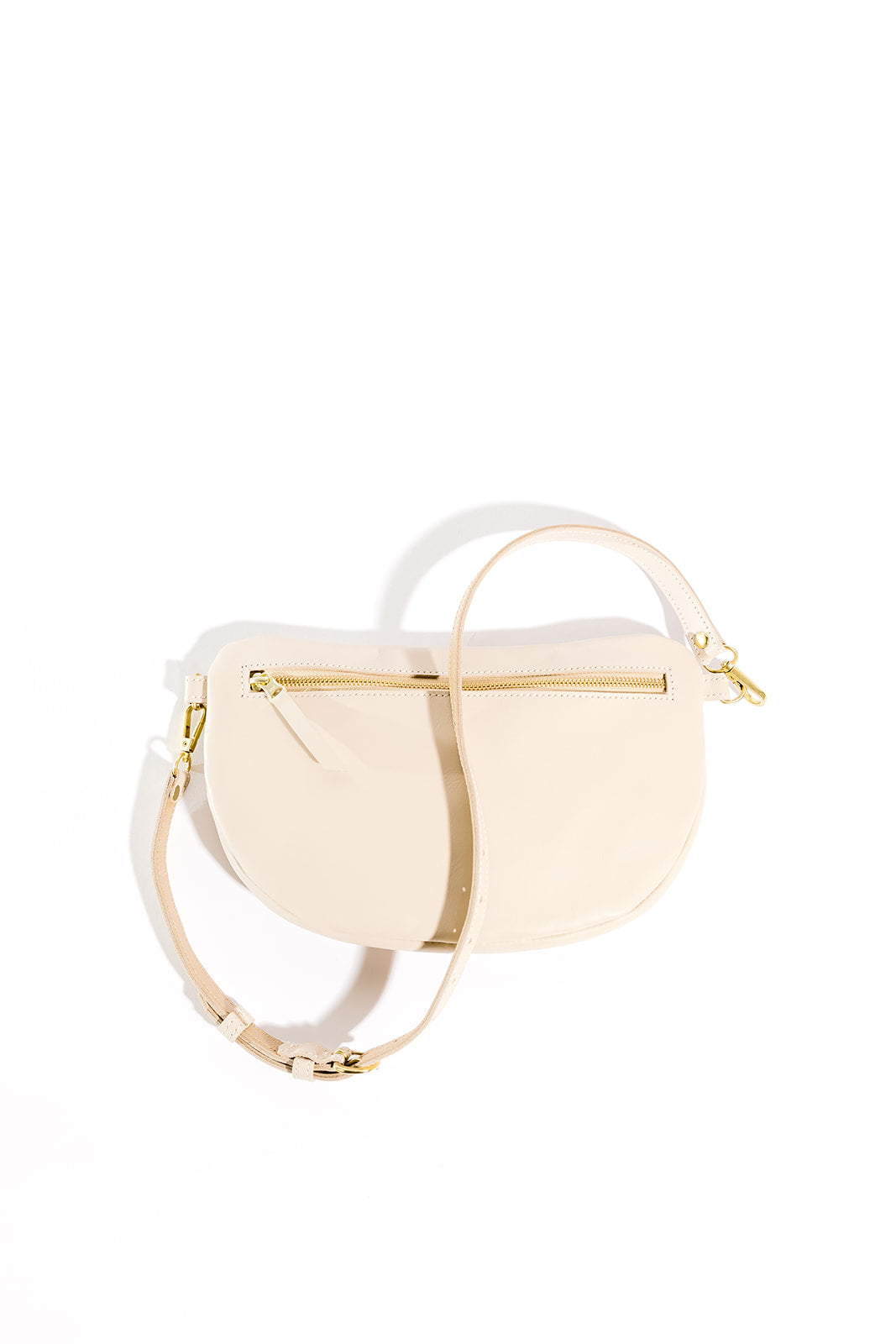 The best-selling Sling Bag is now available in a bigger size. Still sleek, lightweight, and chic, now you'll be able to add that *one* extra thing. Your large wallet, glasses case, or even a small book will fit inside the Big Sling. Fair trade and adjustable leather sling bag/fanny pack.