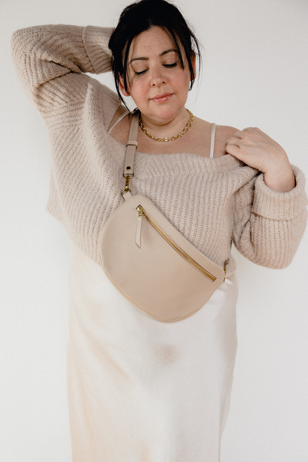 The best-selling Sling Bag is now available in a bigger size. Still sleek, lightweight, and chic, now you'll be able to add that *one* extra thing. Your large wallet, glasses case, or even a small book will fit inside the Big Sling. Fair trade and adjustable leather sling bag/fanny pack.