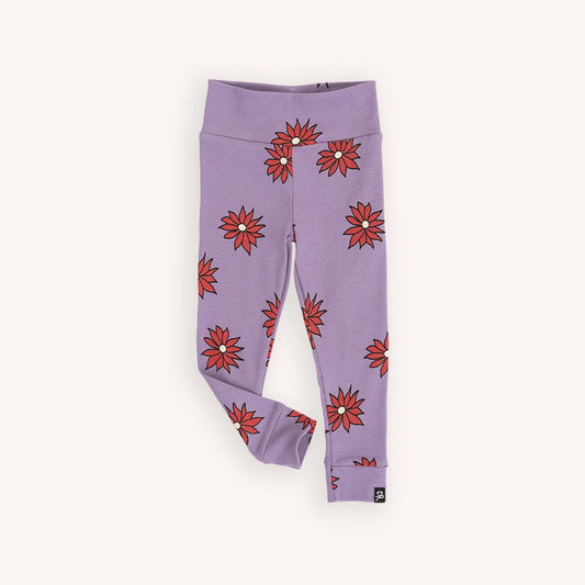 Purple based legging with a red flower print made with 95% organic cotton. Ethically produced, colorful and fun with an eye towards comfort, style and joy. Modern and sustainable kids clothing by CarlijnQ of the Netherlands.