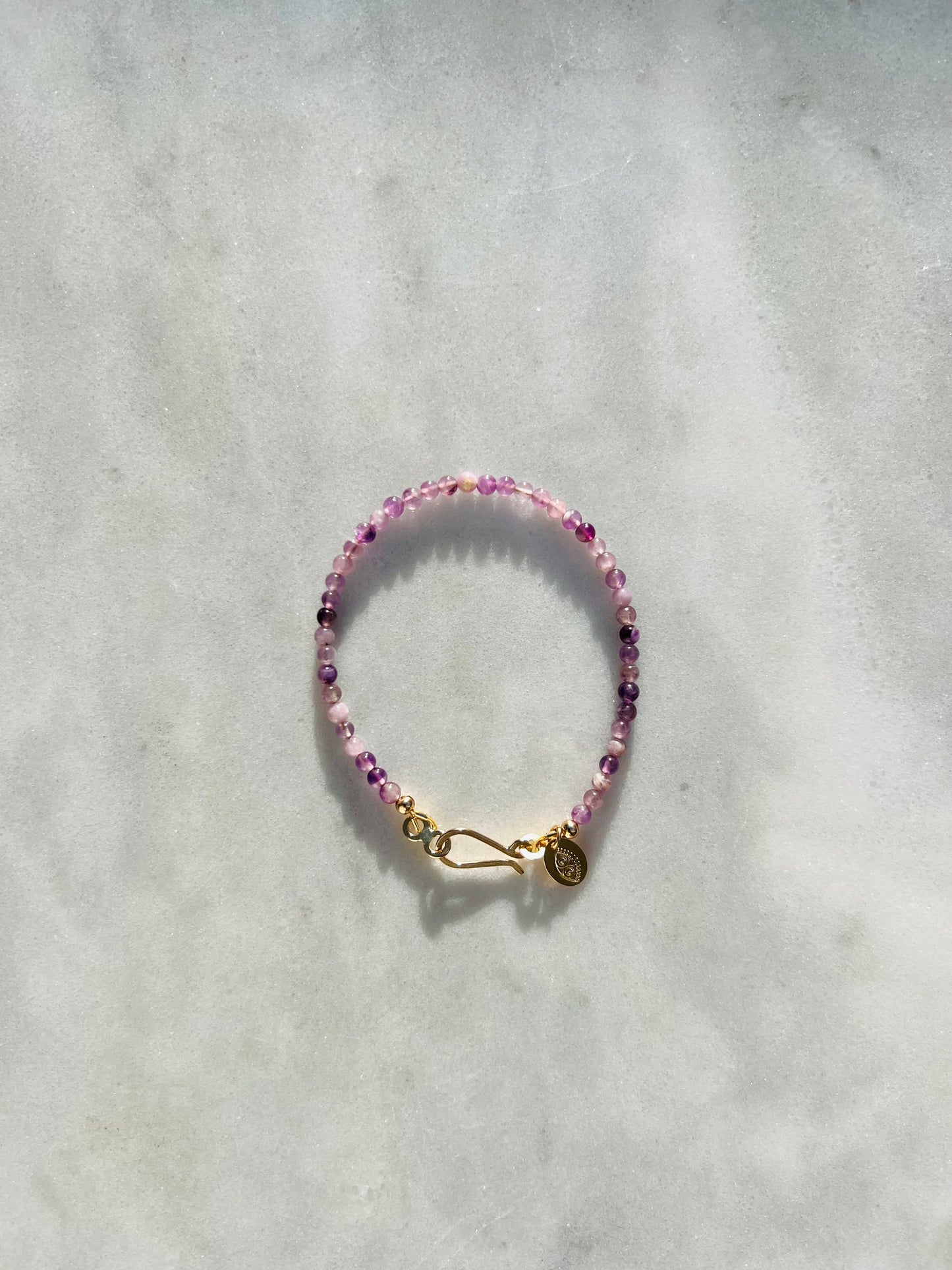 Originally named after its pointy growth pattern, purple calcite beads are smoothed out to rid your aura of stagnancy. From Punkwasp's Power Collection - one of a kind pieces designed to energetically align you with your highest self.