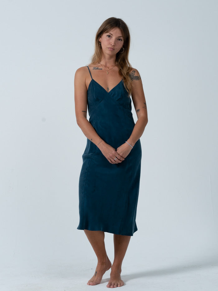The Chelsea slip dress is here to honor your femme side with its flattering shape. Or don't, and grunge it down with some chunky boots and a vintage tee, how ever you want to wear it we think you'll look like great in this dress. Designed in Byron Bay, Australia.