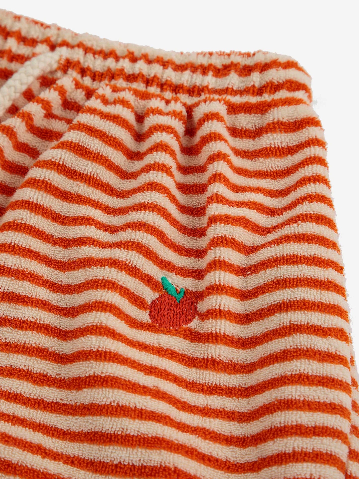 Orange striped harem pants with an embroidered apple detail.


Designed with elasticated waistband, baggy fit, adjustable drawstring, ankle length, fleece, relaxed crotch and turn up hem.

46% organic cotton, 42% cotton, 12% polyester

Made ethically and sustainably in Spain for Bobo Choses.

 