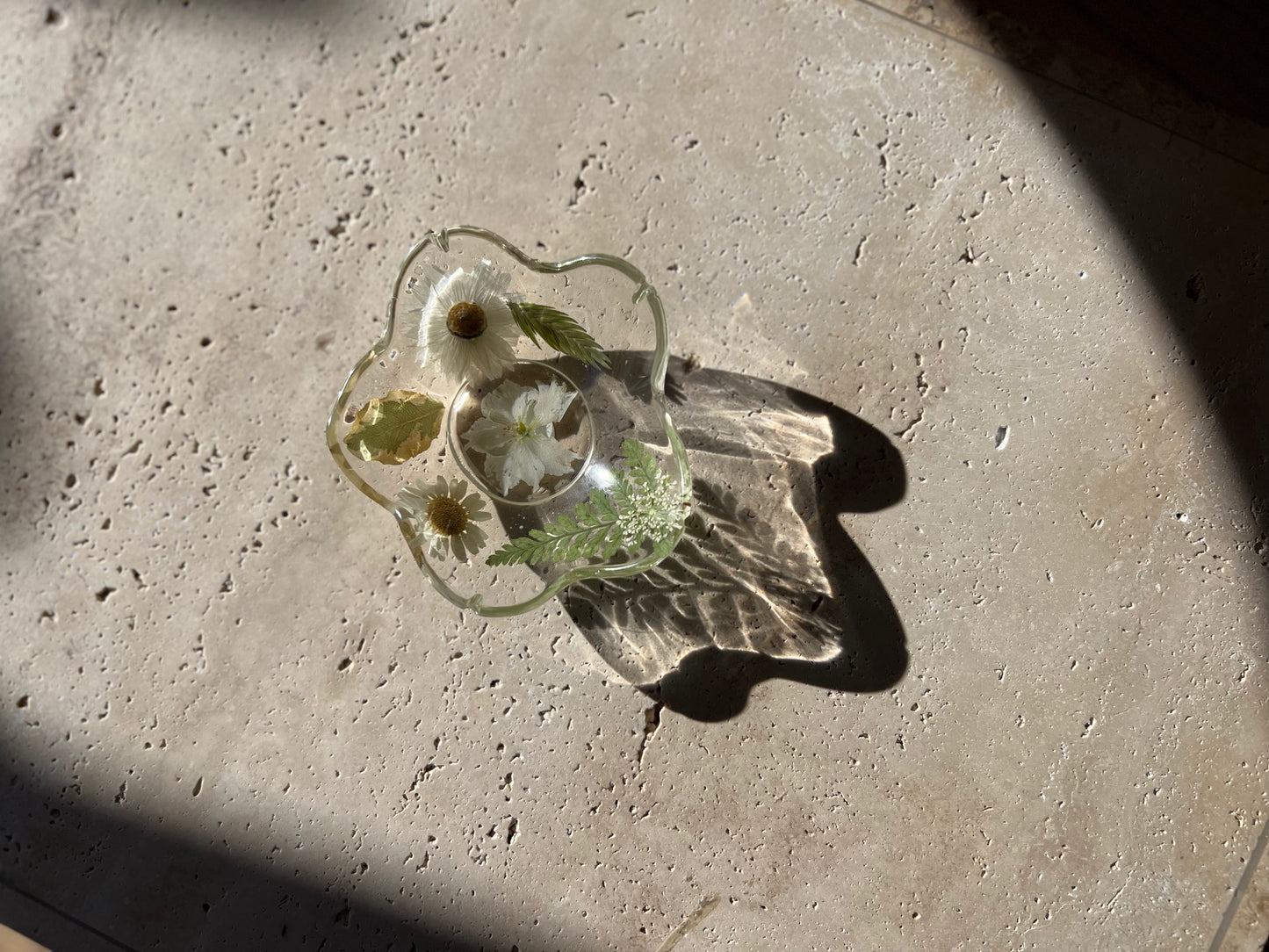 Functional art objects using hand-sourced, dried flowers encased in resin. Each piece is one of a kind and totally unique, made by hand in Lee Meszaros' home studio in Hamilton, Ontario.