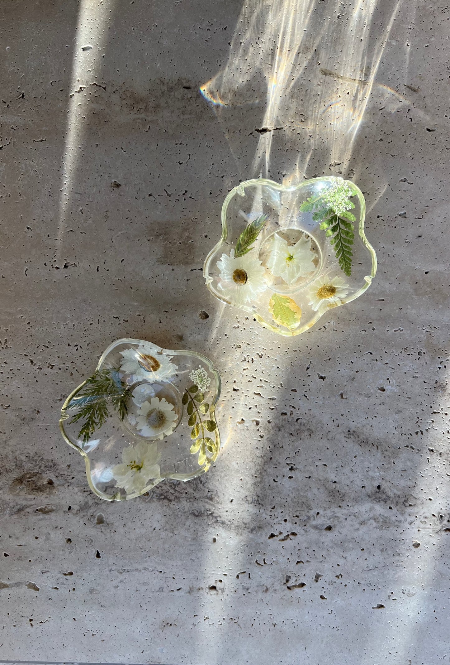Functional art objects using hand-sourced, dried flowers encased in resin. Each piece is one of a kind and totally unique, made by hand in Lee Meszaros' home studio in Hamilton, Ontario.