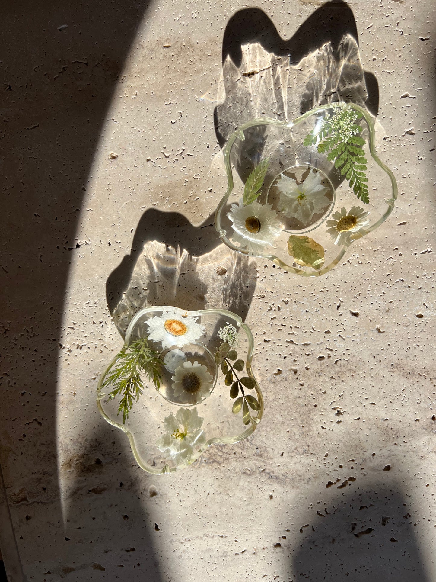 Functional art objects using hand-sourced, dried flowers encased in resin. Each piece is one of a kind and totally unique, made by hand in Lee Meszaros' home studio in Hamilton, Ontario.
