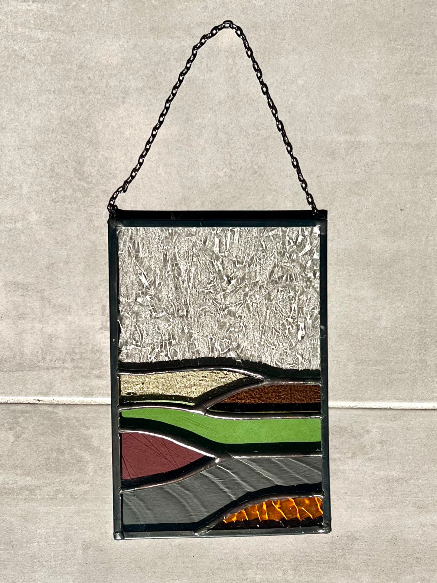 Handmade stained glass pendant with three elements attached by a silver chain. You can hang this panel in a window, on the wall as decor or even an outside patio. Custom made for Thread Spun by Culotta Creations.