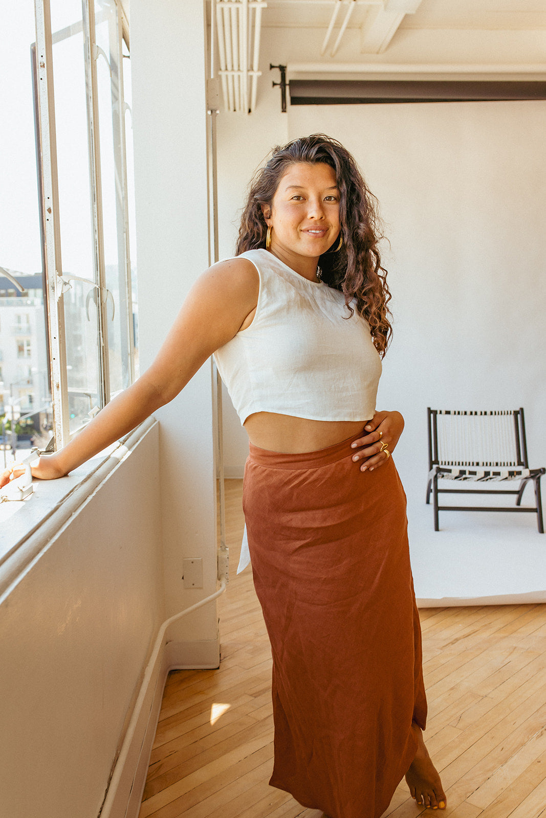 Jardin Midi Skirt: A vintage-inspired skirt with a subtle, feminine a-line shape and sweeping midi-length hemline met with a tailored waistband. Pair it with your favorite tanks and tops for a look that channels our favorite 90s fashion muses. Ethically made in India by Laude the Label.