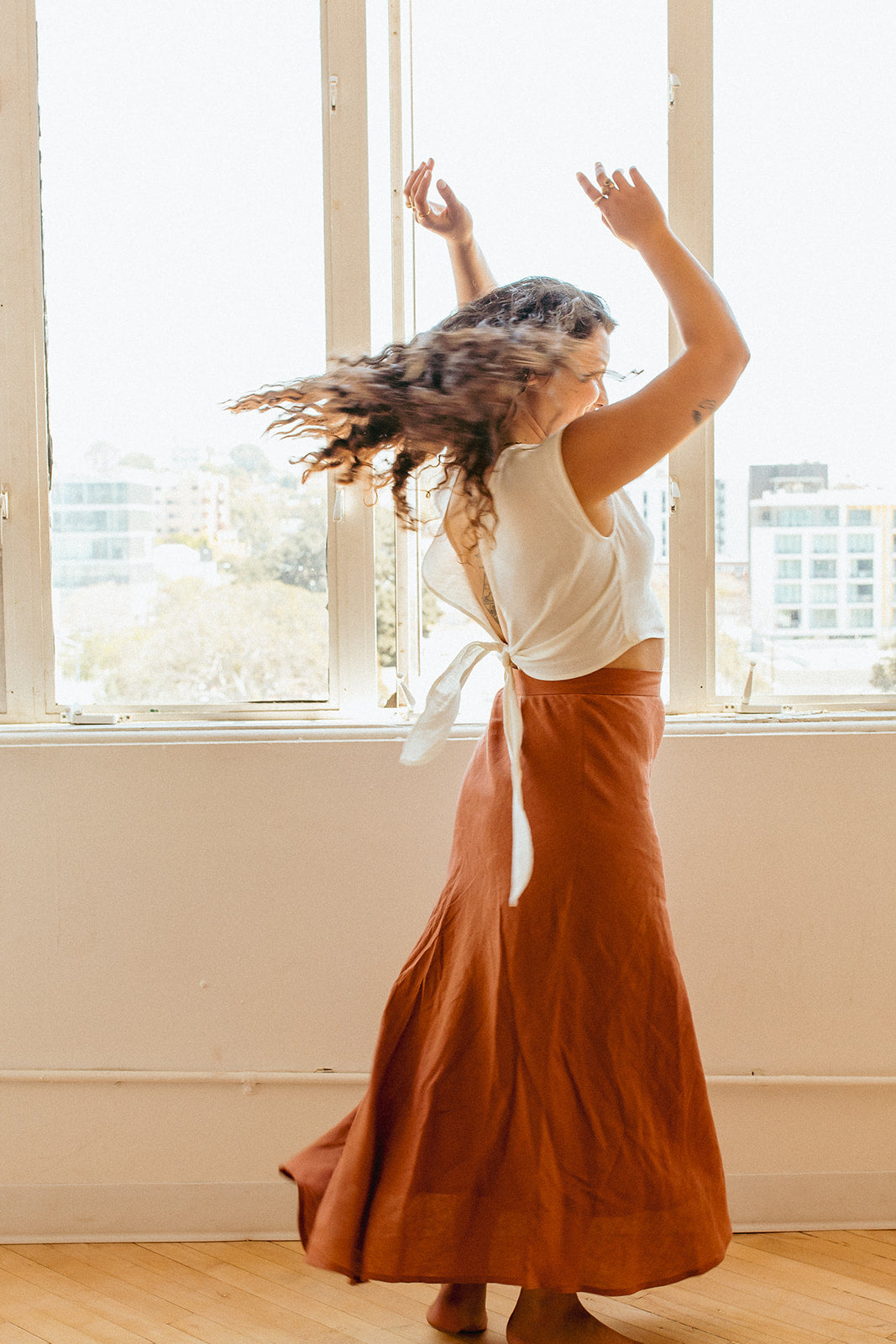 Jardin Midi Skirt: A vintage-inspired skirt with a subtle, feminine a-line shape and sweeping midi-length hemline met with a tailored waistband. Pair it with your favorite tanks and tops for a look that channels our favorite 90s fashion muses. Ethically made in India by Laude the Label.