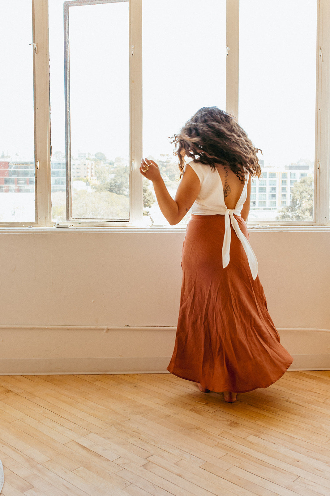 Jardin Midi Skirt: A vintage-inspired skirt with a subtle, feminine a-line shape and sweeping midi-length hemline met with a tailored waistband. Pair it with your favorite tanks and tops for a look that channels our favorite 90s fashion muses. Ethically made in India by Laude the Label.