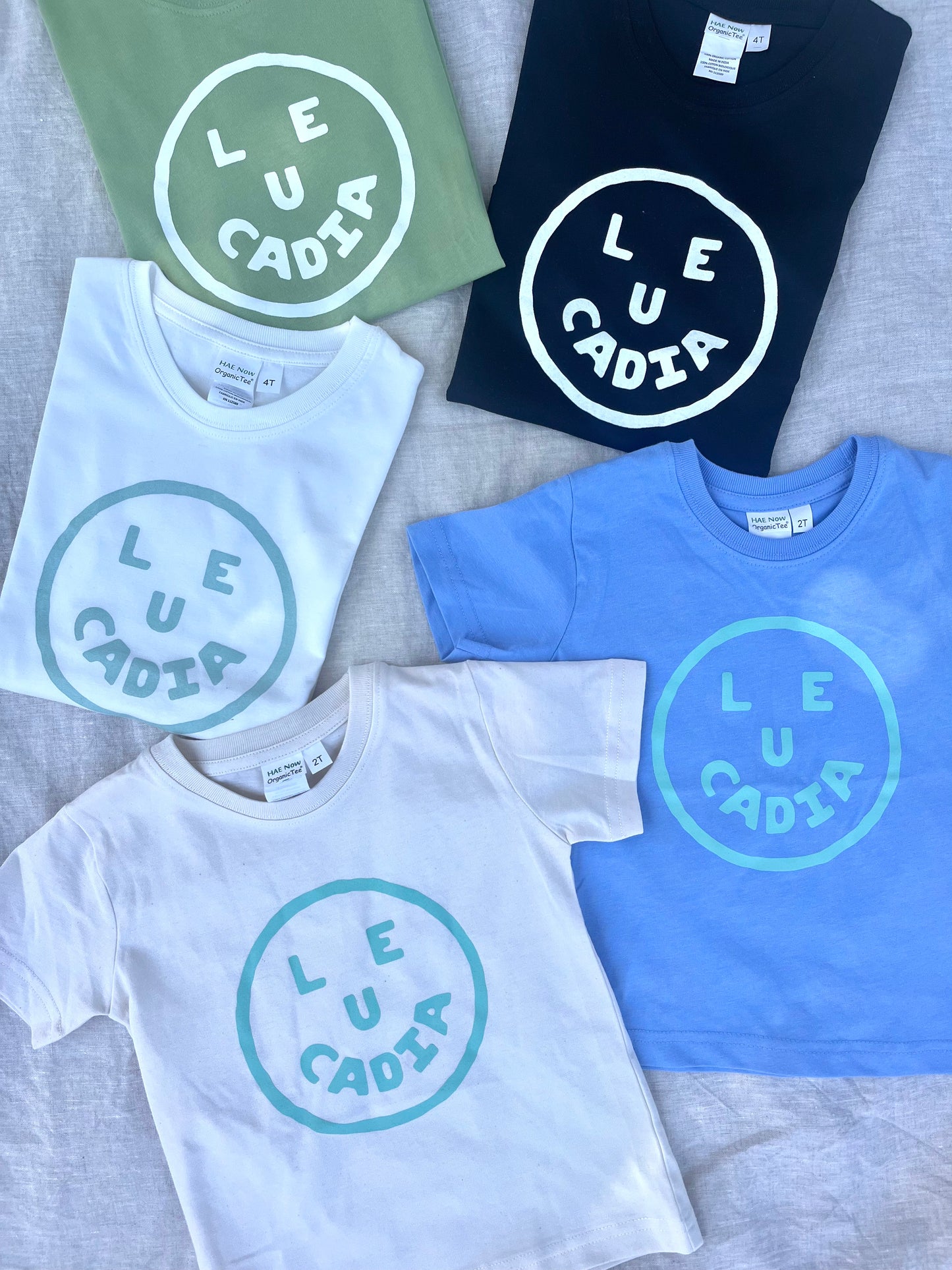 A fun little organic kids tee with a super cute little Leucadia smiley face by local artist Zach Smith. Printed on an organic cotton, fair trade tee with all proceeds to San Diego area families facing housing insecurity. Keep it funky, keep it kind, keep it local.