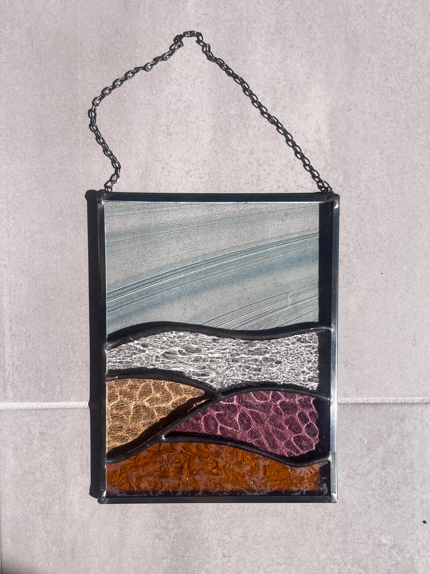 Handmade stained glass pendant with three elements attached by a silver chain. You can hang this panel in a window, on the wall as decor or even an outside patio. Custom made for Thread Spun by Culotta Creations.