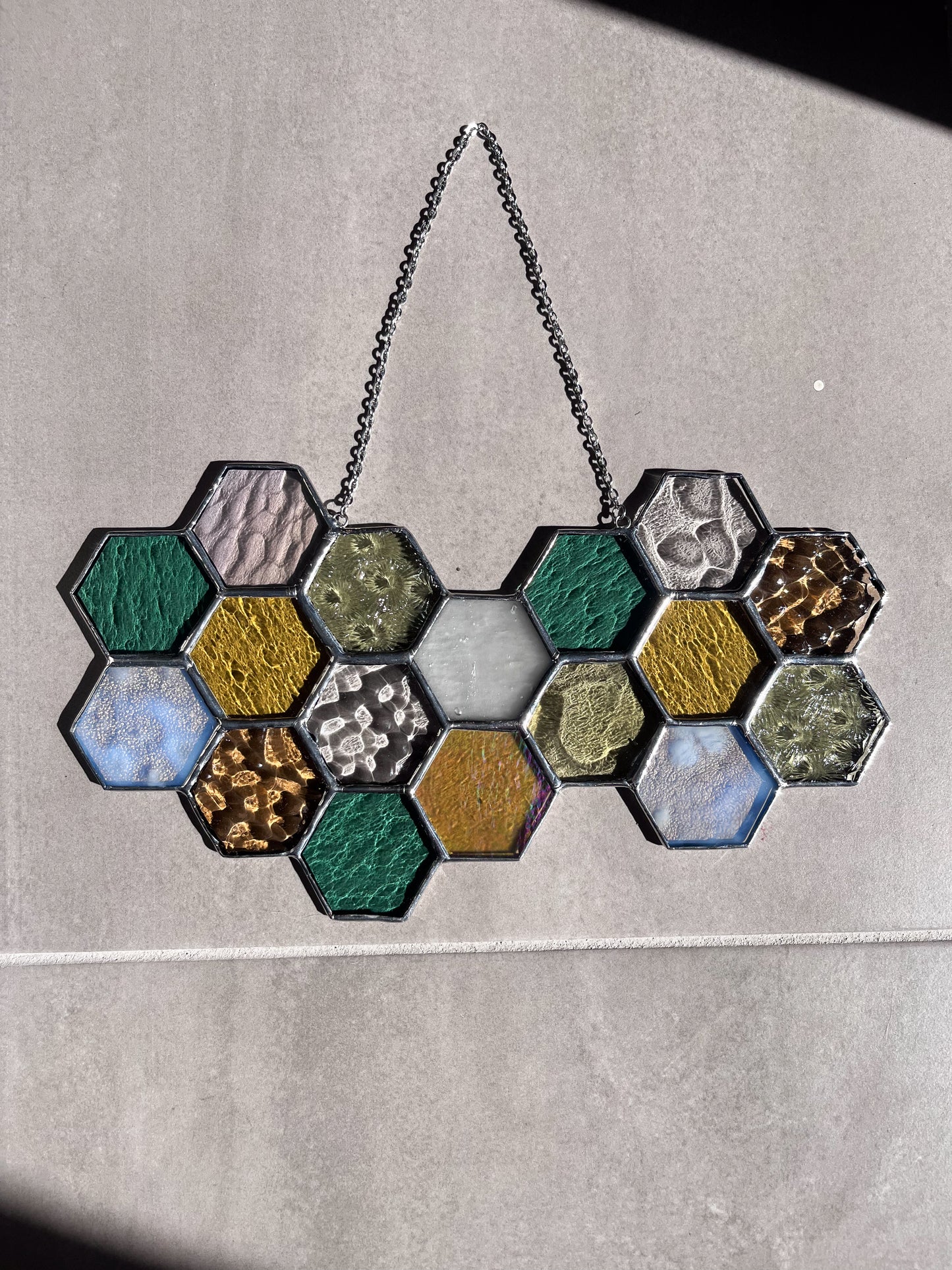 Handmade stained glass pendant with three elements attached by a silver chain. You can hang this panel in a window, on the wall as decor or even an outside patio. Custom made for Thread Spun by Culotta Creations.