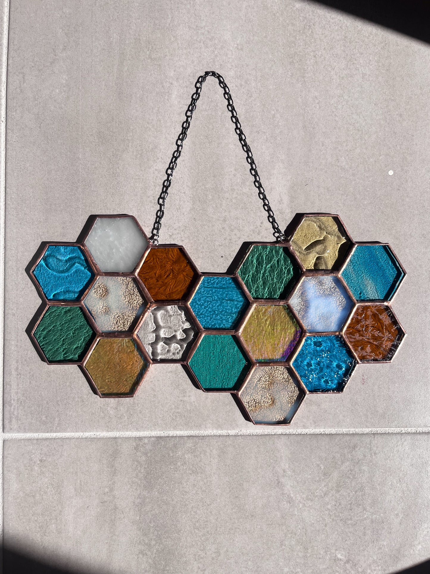Handmade stained glass pendant with three elements attached by a silver chain. You can hang this panel in a window, on the wall as decor or even an outside patio. Custom made for Thread Spun by Culotta Creations.