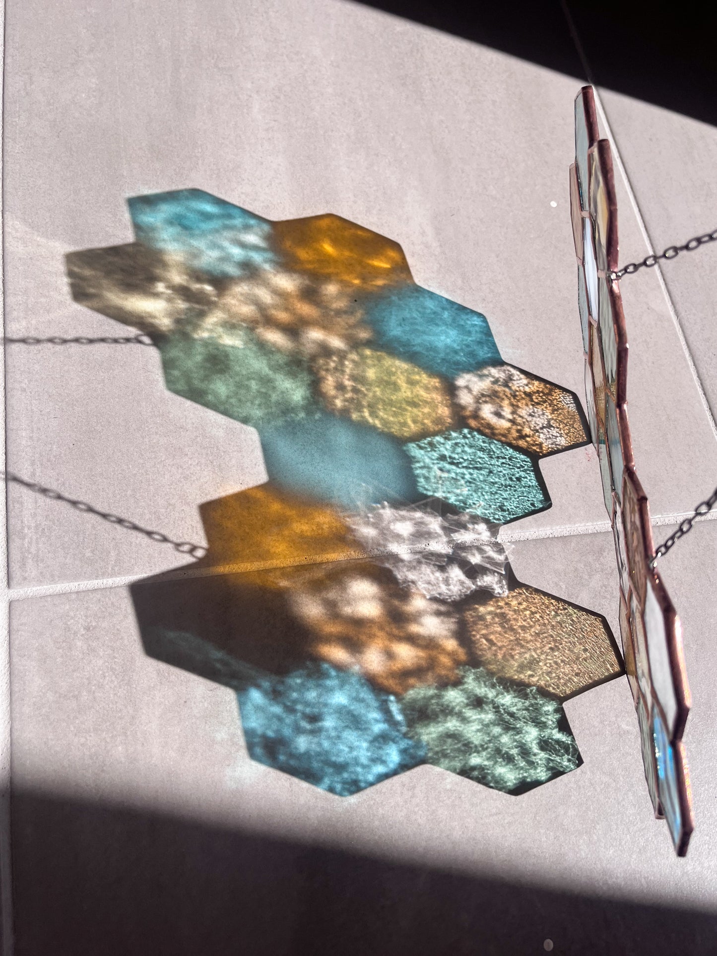Handmade stained glass pendant with three elements attached by a silver chain. You can hang this panel in a window, on the wall as decor or even an outside patio. Custom made for Thread Spun by Culotta Creations.