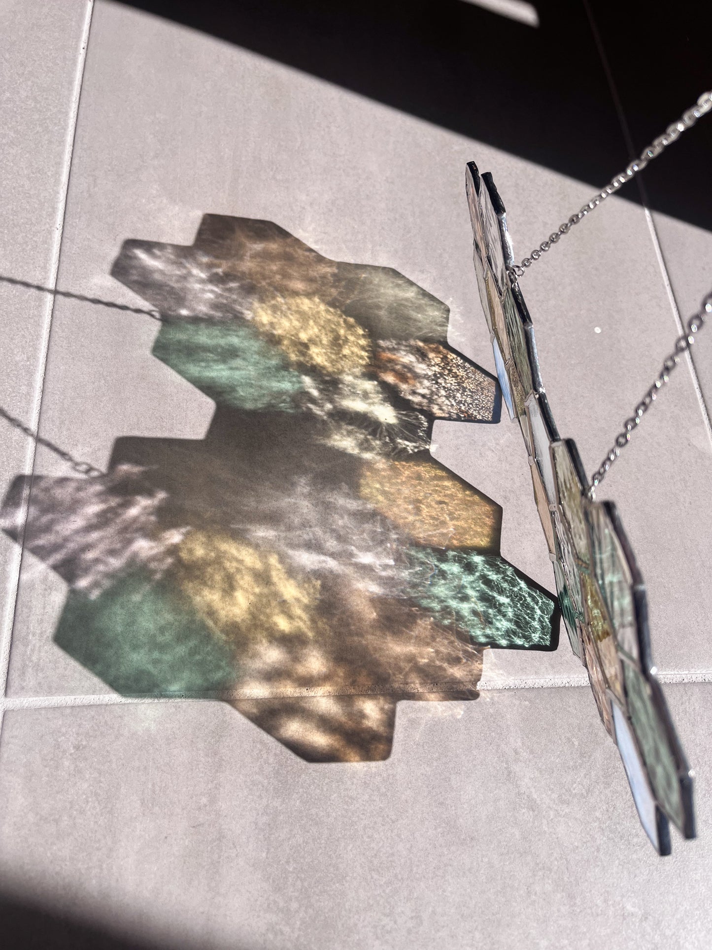 Handmade stained glass pendant with three elements attached by a silver chain. You can hang this panel in a window, on the wall as decor or even an outside patio. Custom made for Thread Spun by Culotta Creations.